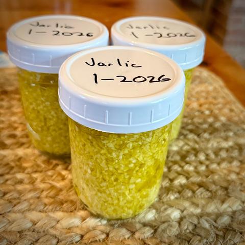 Jars of chopped garlic labeled Jarlic
