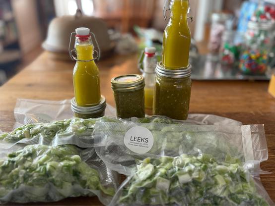 Photo of bags of frozen leeks, Taco sauce and hot sauce.
