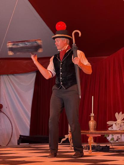 A man spinning a suitcase on his finger