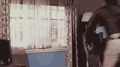 Cowboy escaping by jumping through a windows