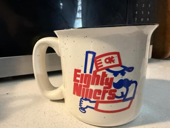 Coffee mug with the old Eighty-niners team logo on it.