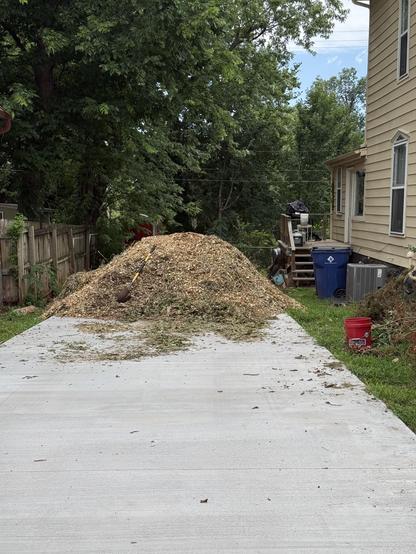 Big wood chip pile on a driveway