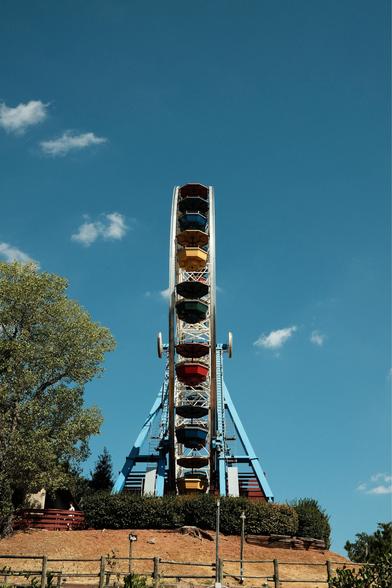 A Ferris Wheel in a blue sky.