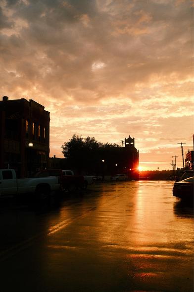 Sunset reflected off of a wet street.